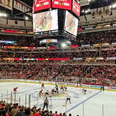 a hockey game is being played in an arena