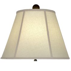 a lamp that is sitting on top of a table with a white lampshade