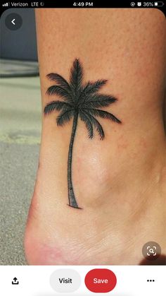 a small palm tree tattoo on the side of a woman's foot is shown