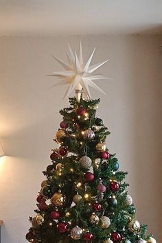 a decorated christmas tree in a living room