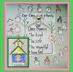 a classroom bulletin board with pictures and words on it that say our class is a family