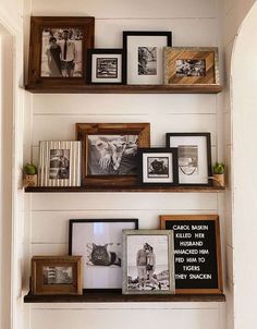 three wooden shelves filled with pictures and framed photos on them, along with other decorative items