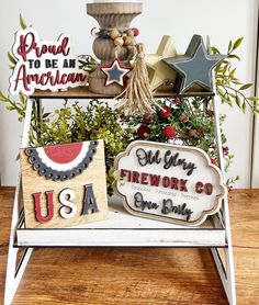 an assortment of patriotic signs and decorations on a stand