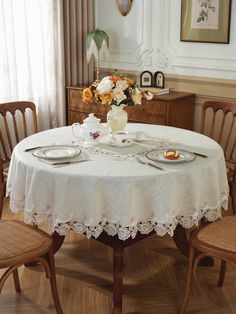 the table is set with plates and cups