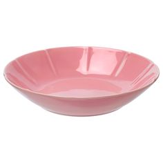 a pink bowl sitting on top of a white table