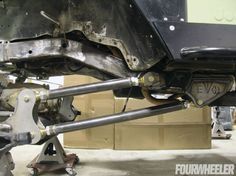 the rear end of a vehicle with metal parts on it