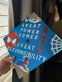 someone is holding up a graduation cap that reads, which great power comes great resonsibility