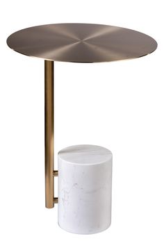 a white table with a gold metal base