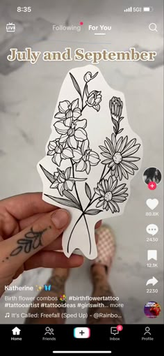 someone holding up a sticker with flowers on it and the words july and september