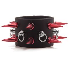 Made from real locally sourced California leather this wristband is durable, soft and supple. This wristband comes with two awesome rows of red 1 1/4 inch tall spikes and has a center row of mini ball and ring posts. This wristband fastens with a single button. Adjustable Punk Wristband, Edgy Adjustable Wristband With Wrist Strap, Adjustable Edgy Wristband With Wrist Strap, Black Leather Bracelet With Spikes For Concerts, Black Leather Spike Bracelets, Edgy Leather Bracelet With Spikes, Black Leather Spiked Bracelets, Adjustable Red Edgy Jewelry, Adjustable Spiked Punk Wristband