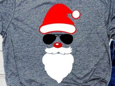 a t - shirt that has a santa hat and sunglasses on it's chest