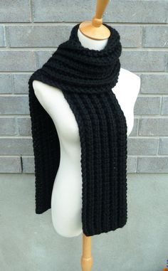 "This beautiful hand knitted scarf is made with Super Bulky and Soft Wool Blend Yarn (80% Acrylic, 20% Lambswool). Classic ribbed pattern, it looks the same on both sides. The scarf can be worn in multiple ways. Amazing color for the fall/winter season. It goes with everything. The color may appear slightly different on different monitors. Measures: 63\" (160 cm) long x 7\" (17 cm) wide. From a smoke-free home. Care instructions: Hand wash in cool water and dry flat." Crochet Muffler For Boyfriend, Black Knit Scarf, Black Scarf Aesthetic, Hand Knitted Acrylic Yarn Scarf For Cold Weather, Hand Knitted Acrylic Yarn Scarves For Cold Weather, Winter Hand Knitted Black Knitting Pattern, Black Knitted Scarves For Winter, Black Knitted Scarf For Winter, Black Knitted Winter Scarf