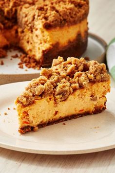 a piece of pie sitting on top of a white plate next to a slice of cake