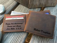 "This listing is for a personalized brown leather Bi-Fold wallet with an optional engraved message inside. This wallet has RFID protection to guard your credit cards against electronic theft. There are 8 credit card slots, 4 on each side of the wallet and 2 billfold pockets for paper money.  This wallet is made with real Crazy Horse Leather. It is a stiff and durable leather with a rustic appearance. INSTRUCTIONS: The first/last name and message are burned into the wallet. The personalized messa Happy 3rd Anniversary, Engraved Knife, Custom Wallet, Wallet For Men, Personalized Wallet, Leather Bifold Wallet, Money Clip Wallet, Monogram Gifts, Fold Wallet