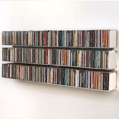 the wall is filled with many different types of cd's