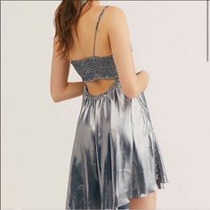 Free People Grey Metallic Just Dance Babydoll Slip Mini Dress. New Without Tags! Shine All Night In This Metallic Mini Slip Dress Featuring A Ruched Sweetheart Neckline And Flowing A-Line Skirt, Accented By A Keyhole Back Cutout. Adjustable Straps Stretchy Smocked Back Unlined Design Measurements For Size Small Length: 27.5 In Bust: 32.75 In Shiny Silver Summer Dresses, Shiny Silver Mini Dress For Summer, Summer Shiny Silver Mini Dress, Sleeveless Metallic Silver Dress For Summer, Metallic Silver Sleeveless Dress For Summer, Metallic Silver Sleeveless Summer Dress, Summer Silver Satin Dress, Pink Tunic Dress, Silver Metallic Dress