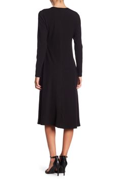 This long sleeve A-line dress is great for the office or dinner and makes for a classy, put-together look.Fit: this style fits true to size. Crew neck. Long sleeves. A-line skirt. Approx. 43" length (size S). Made in USA Black Long Sleeve Midi Dress For Fall, Stretch A-line Midi Dress For Work, Winter A-line Midi Dress For Office, Solid Long Sleeve Midi Dress For Office, Black Long Sleeve Midi Dress For Work, Black Long Sleeve Business Dress, Elegant Long Sleeve Stretch Dress, Fall A-line Office Dresses, Chic Long Sleeve Business Dresses