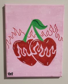 two cherries painted on a pink canvas