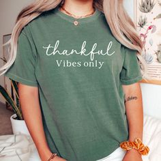 Comfort Colors© Spread positivity with our 'Thankful Vibes Only' T-shirt! This stylish tee is the perfect way to express your gratitude and keep the good vibes flowing. Wear it and share the thankful spirit everywhere you go! Unfortunately we do not offer returns or exchanges as these are printed per order. If you have any manufacturing issues we will do our best to make it right.    https://gndesignertees.etsy.com Comfort Colors introduces its garment-dyed t-shirt; a fully customizable tee made 100% with ring-spun cotton. The soft-washed, garment-dyed fabric brings extra coziness to your wardrobe while the relaxed fit makes it an excellent daily choice. The double-needle stitching throughout the tee makes it highly durable while the lack of side-seams helps the shirt retain its tubular sh Good Vibes Shirt, Thankful Shirt, Positive Shirt, Spread Positivity, Thanksgiving Shirt, Thanksgiving Shirts, Dye T Shirt, Good Vibes, Comfort Colors