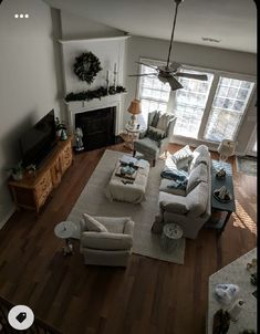 a living room filled with furniture and a fire place