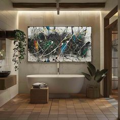 a bath room with a large painting on the wall and a plant next to it