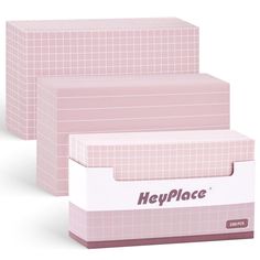 three pink boxes are stacked on top of each other with the words help place printed on them