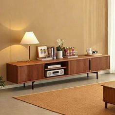 a living room scene with focus on the entertainment center and coffee table in the foreground