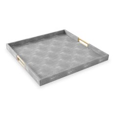 a gray tray with gold handles