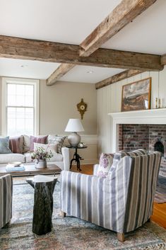 a living room filled with furniture and a fire place