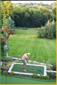 a man is playing golf in his backyard