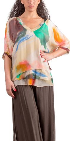 Abstract Painted Design on 100% Silk Blouse with Frayed Raw Edge Hemline. Soft, Stretchy Viscose Layer Underneath. 100% Silk Exterior | 95% Viscose | 5% Elastic Interior Made in Italy Fits Sizes XS- XL Model 5'7 Summer Beige Silk Blouse, Beige Silk Blouse For Summer, Casual Silk Top For Spring, Chic Multicolor Viscose Blouse, Beige Silk V-neck Top, Flowy Silk Blouse For Spring, Casual Flowy Silk Tops, Multicolor Silk Short Sleeve Top, Multicolor Silk V-neck Top