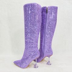 New In Box Faux Suede Upper Covered In Bling Mirror Tile Rhinestones Tinted 4" Translucent Spool Heels For More Stability Full Side Zipper For Easy On And Off Top Opening Measures Approx. 15" Shaft Measures Approx. 14.5" Party Boots With Rhinestone Rivets, Silver Rhinestone Boots For Party Season, Glamorous Rhinestone Cocktail Boots, Purple Rhinestone Pointed Toe Heels, High Heel Rhinestone Boots For Cocktail, Glamorous High Heel Purple Boots, Cocktail High Heel Boots With Rhinestones, Elegant Purple Party Boots, Purple Rhinestone Heels With Round Toe