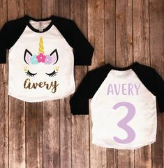 two shirts with unicorn faces on them and the number three printed on one shirt that says avery