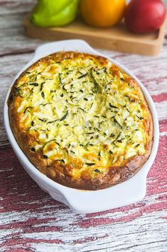 a casserole dish with spinach and cheese in it sitting on a table