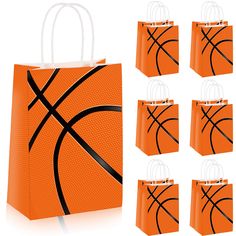 an orange bag with basketballs on it and six small bags in front of it