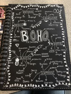 a black notebook with writing on it and pictures in the bottom right corner that says boho