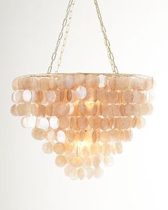 a chandelier hanging from a gold chain