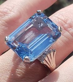 This gorgeous ring is definitely the very definition of a statement ring. 15.79 ctw of a beautiful emerald cut blue topaz set in 9 grams of white gold. From the art deco era. Ring is in lovely condition. Size 5.75 and easily sizable by any local jeweler. Please message me with any additional questions. Stay well! Love, Ellen xo Vintage Eternity Band, Baguette Diamond Band, Yellow Gold Solitaire Ring, Deco Blue, Gold Solitaire Ring, Gorgeous Ring, Solitaire Setting, Lovely Ring, Art Deco Era