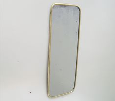 a mirror that is sitting on the wall