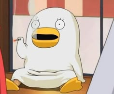 a cartoon character sitting in front of a computer screen and holding a pen to his mouth