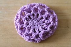 a crocheted object sitting on top of a wooden table