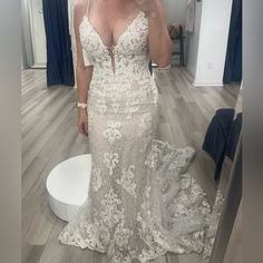 a woman taking a selfie in her wedding dress