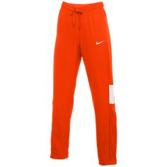 A TRAIN AND TRAVEL ESSENTIAL. Warm up or cool down in the Nike Dri-FIT Pants. The sweat-wicking fabric helps you stay dry and comfortable, while the lower leg button placket lets you change easily over shoes. Dri-FIT technology helps keep you dry, comfortable and focused. Soft, woven fabric lets you move freely. A 3-button placket with snaps on the lower legs make it easy to change over shoes. Side pockets for stashing your small items. Waistband with drawcord secures a snug fit. 100% polyester Team Orange, Lower Leg, Fit Pants, A Train, Small Items, Button Placket, Nike Dri Fit, Workout Pants, Travel Essentials