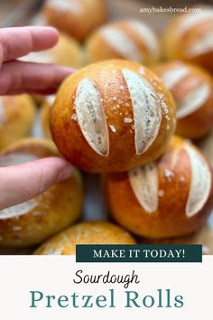 someone is holding some bread with white icing on it and the words make it today sourdough pretzel rolls