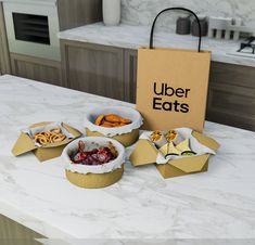 an open box sitting on top of a counter filled with food