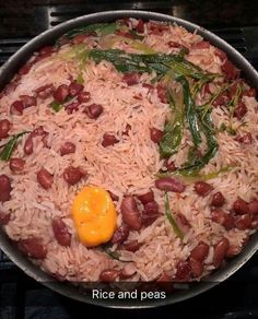 rice and peas in a pan on the stove