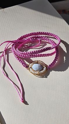 Handmade satin macrame magenta double wrap bracelet with pearl and moonstone pendant. * M A T E R I A L * Main stone : Natural Freshwater Pearl Closure & Findings :satin rattail cord * D I M E N S I O N * Length: 7 inches with extension * A B O U T * Nik's Petite Shop https://www.etsy.com/shop/NiksPetiteShop#about M O R E * FROM * SHOP  https://www.etsy.com/shop/NiksPetiteShop * FOLLOW * US IG: @nikspetiteshop Thank you so much for visiting and hope you enjoy shopping here at NPS. Feel free to c Bohemian Bracelets With Adjustable Pearl Charm, Bohemian Bracelet With Adjustable Pearl Charm, Adjustable Bohemian Bracelet With Pearl Charm, Bohemian Adjustable Bracelet With Pearl Charm, Beachy Jewelry, Bracelet Macrame, Bracelet Cordon, Double Wrap Bracelet, Bracelet Pearl