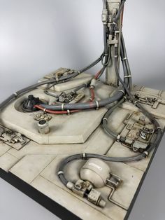 a model of a space station with wires and other equipment on it's surface