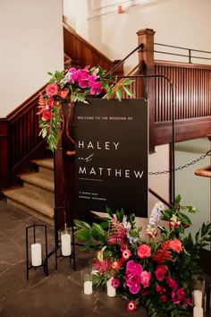 flowers and candles are on the ground in front of a sign that says haley mathew