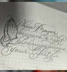 a piece of paper with writing on it and an image of a praying hand in the middle